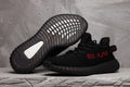 Yeezy Boost 350 V2 Black Knit Sneakers with Red Accents