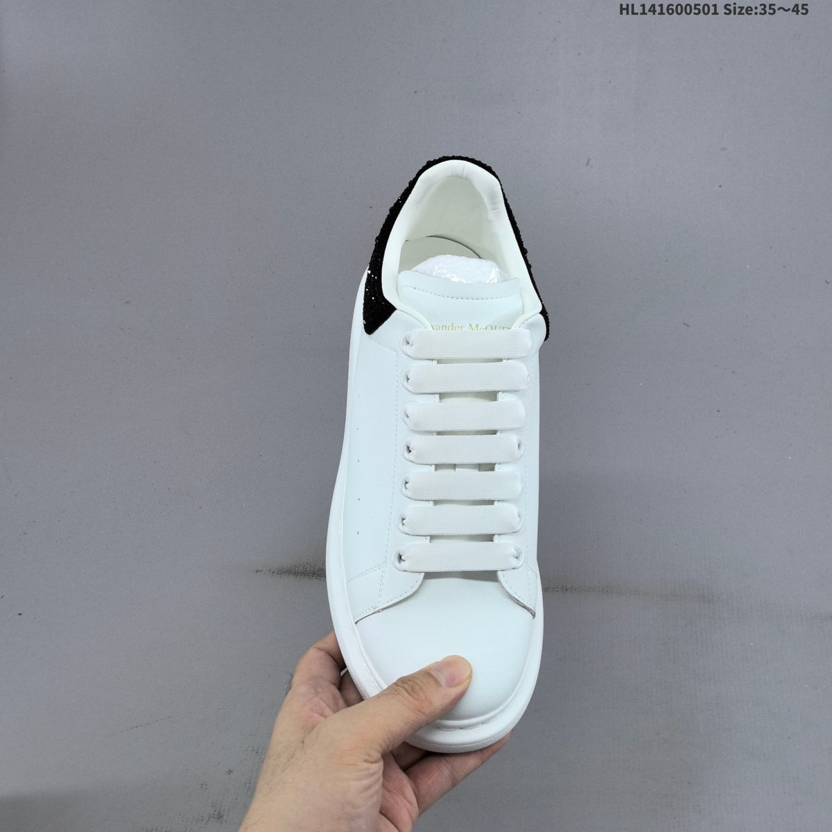 Alexander McQueen Oversized White Low-Top Sneakers with Black Heel