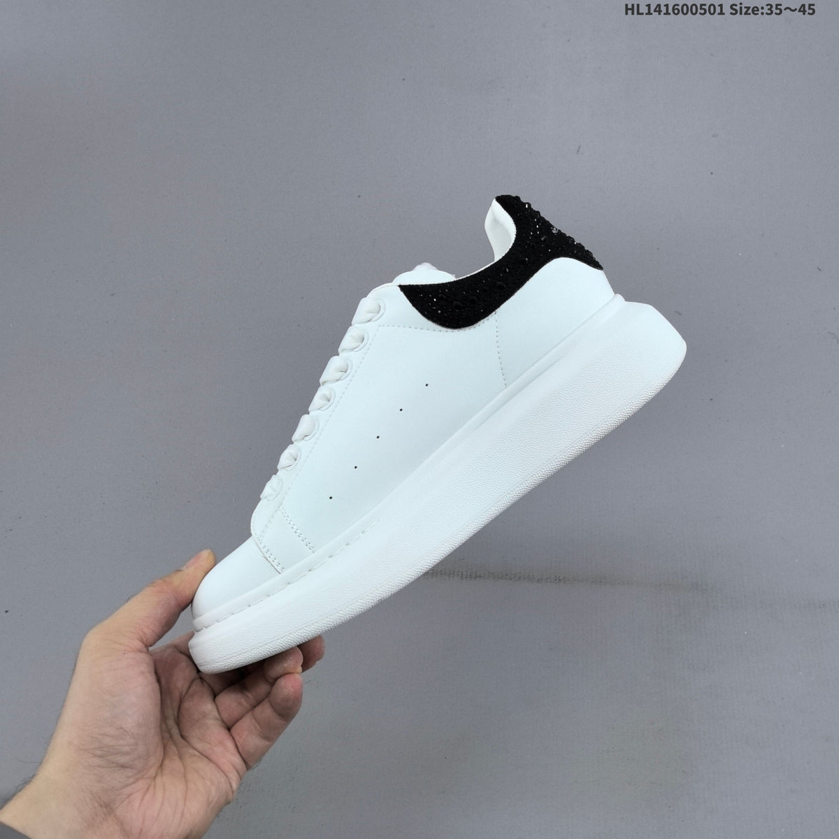 Alexander McQueen Oversized White Low-Top Sneakers with Black Heel