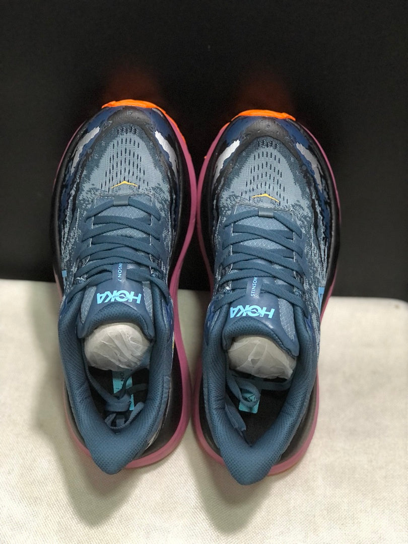 HOKA Stinson 7 Trail Running Shoes in Blue and Orange