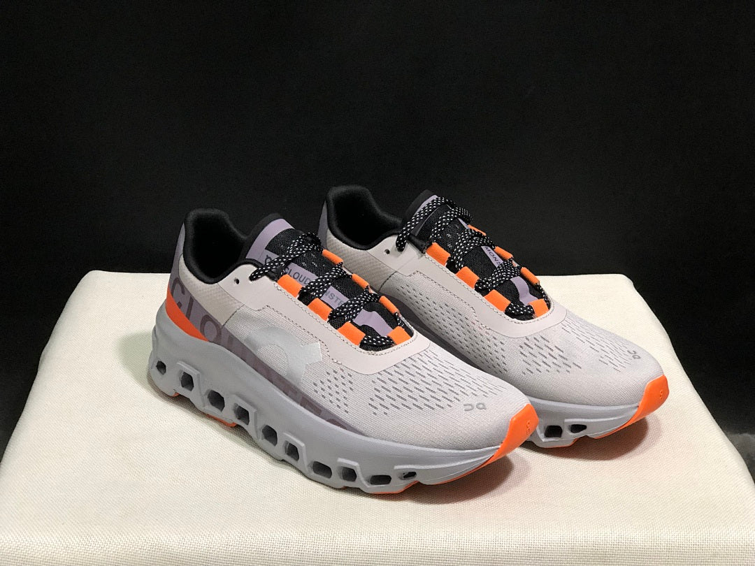 On Cloudmonster Sneakers in Foggy White and Orange
