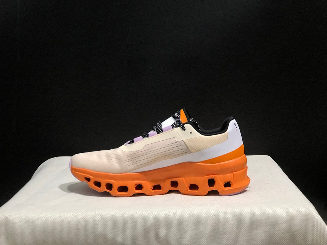 On Cloudmonster Running Shoes in Yellow Tan and Orange