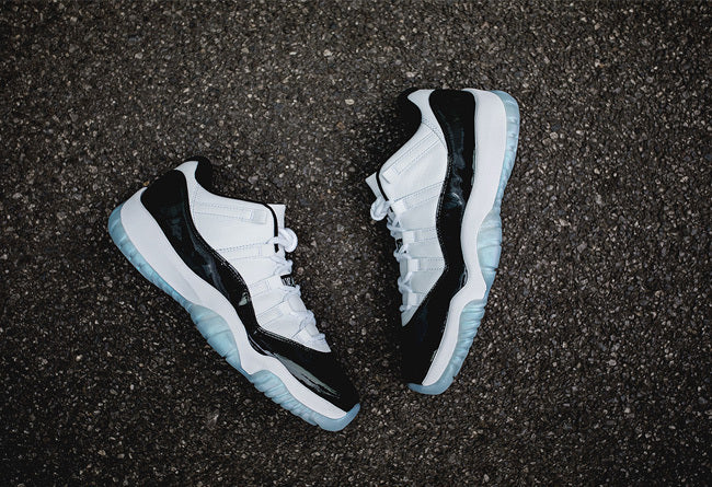 Air Jordan 11 Iridescent Sneakers in White and Black