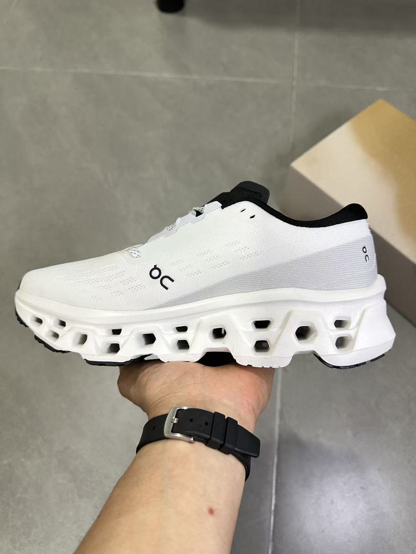 On Running White and Black Running Shoes