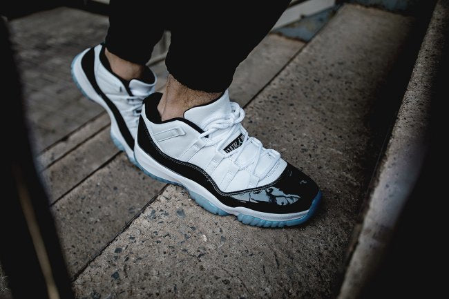 Air Jordan 11 Iridescent Sneakers in White and Black