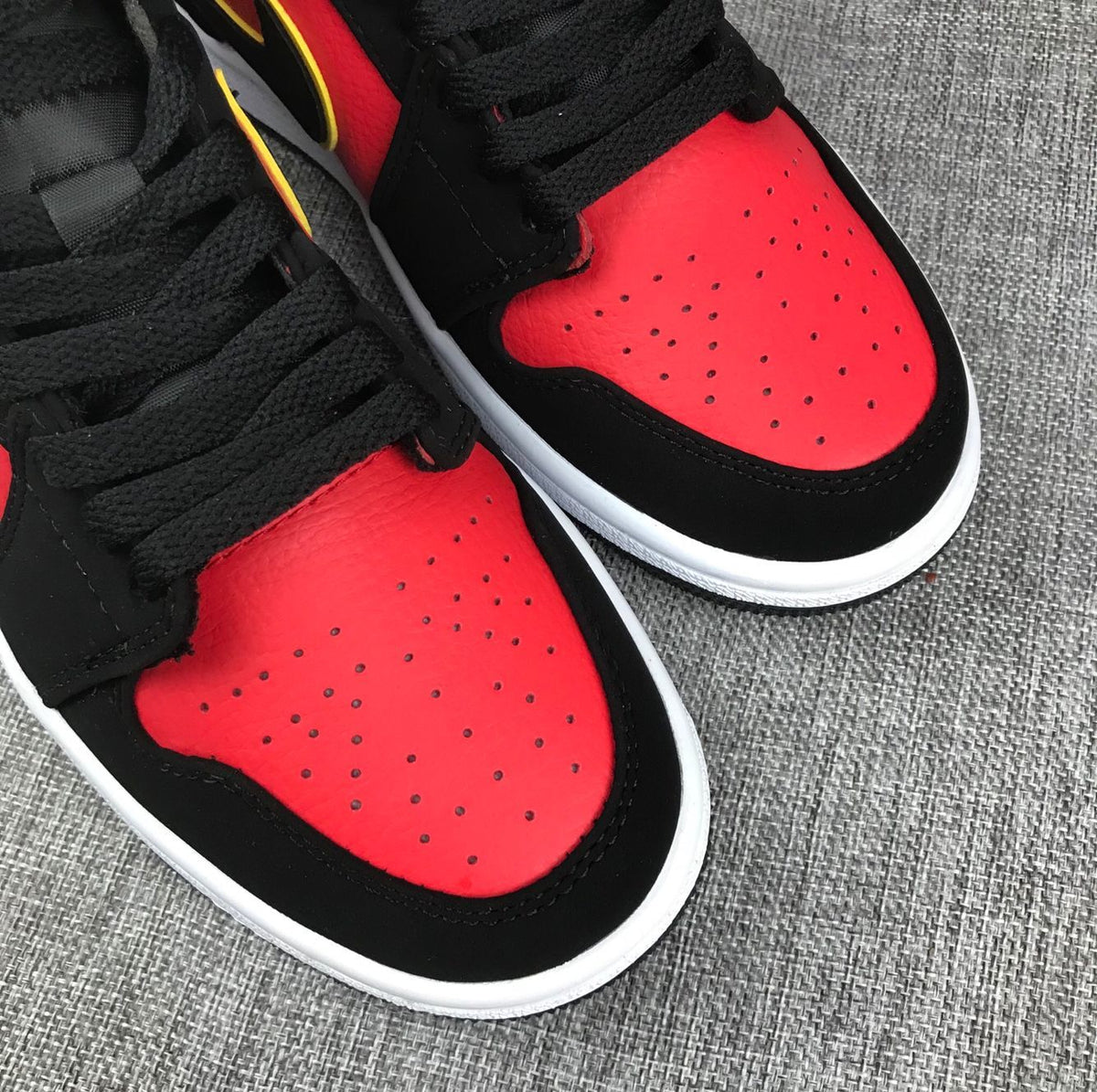Air Jordan 1 Mid Black, Red and Volt Sneakers