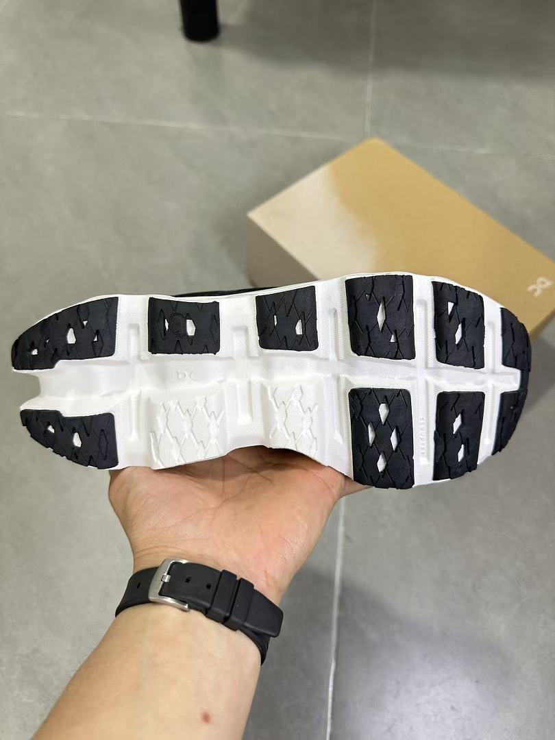 On Running Black and White Road Running Sneakers