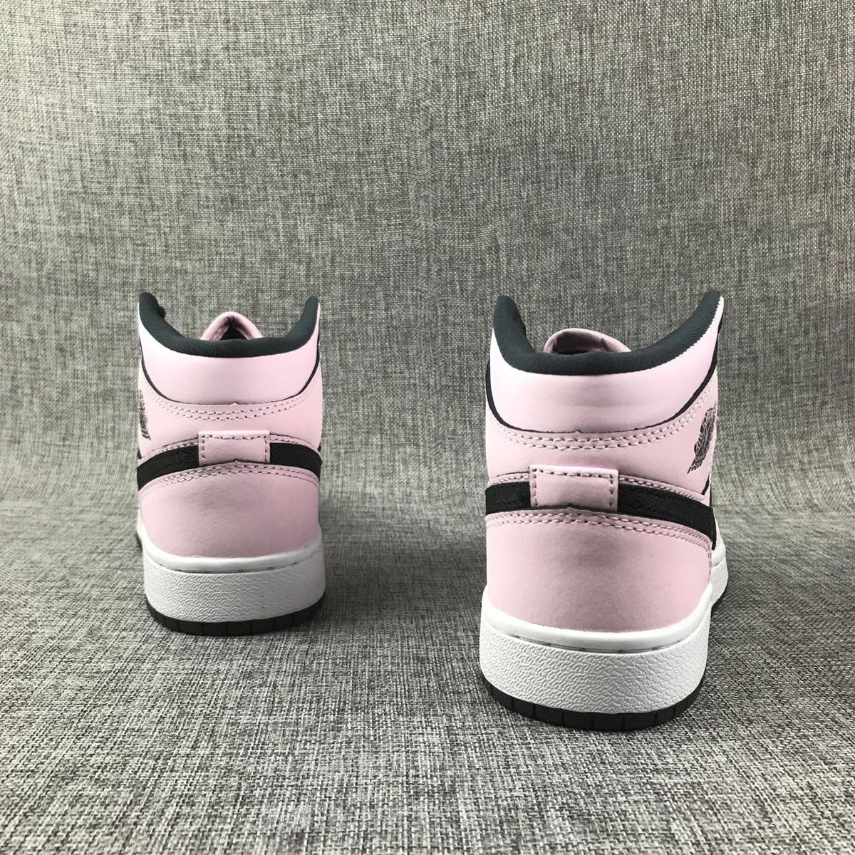 Air Jordan 1 Mid Pink and Black High-Top Sneakers