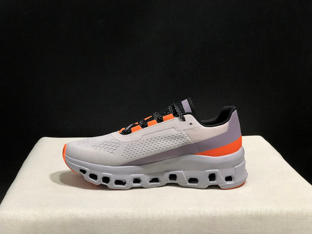 On Cloudmonster Sneakers in Foggy White and Orange