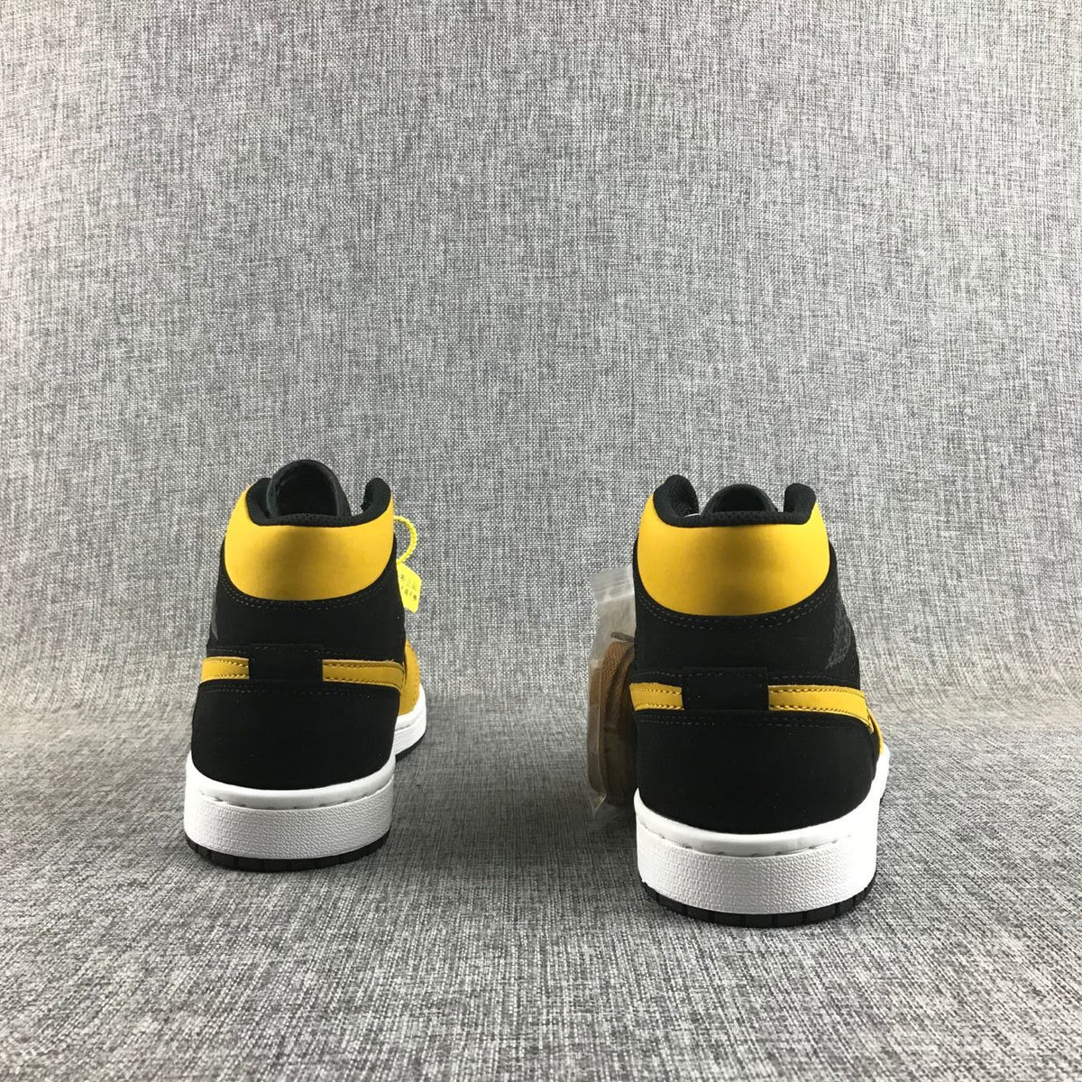 Air Jordan 1 Mid Black and Yellow Sneakers