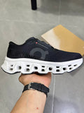 On Running Black and White Road Running Sneakers