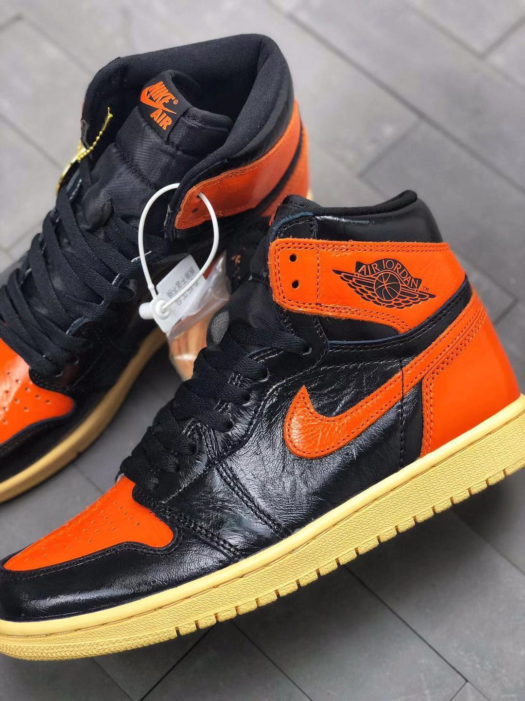 Air Jordan 1 Retro High OG Black and Orange Sneakers
