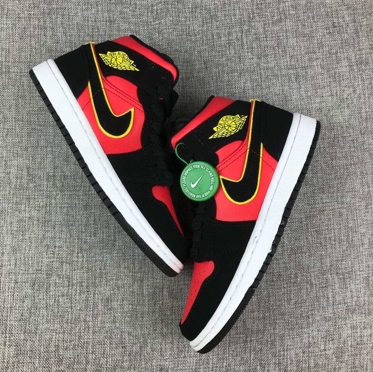 Air Jordan 1 Mid Black, Red and Volt Sneakers