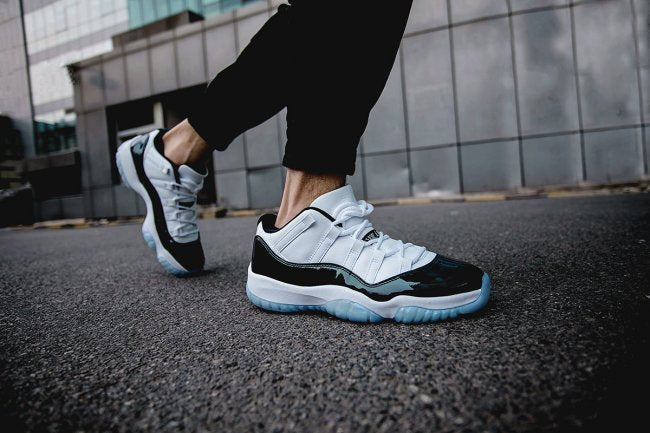 Air Jordan 11 Iridescent Sneakers in White and Black