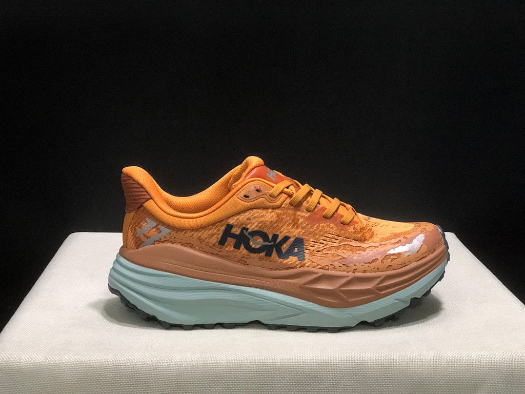 HOKA Stinson 7 Trail Running Shoes in Orange